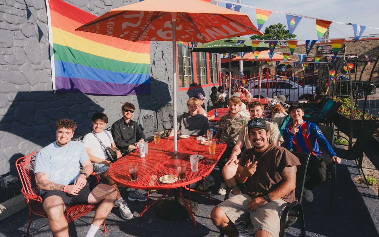 Young people gather around a table at a Summerfest Social.